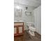 Basement bathroom with wood-look tile flooring, vanity, and a toilet at 150 Gill Ln, Stockbridge, GA 30281