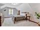 Bedroom with neutral walls offers a tranquil escape with views from the bright window at 150 Gill Ln, Stockbridge, GA 30281