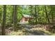 Long driveway approaching a brick home with a two-car garage at 150 Gill Ln, Stockbridge, GA 30281