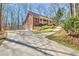 Two-story brick home featuring a covered front porch, two-car garage, and landscaped yard at 150 Gill Ln, Stockbridge, GA 30281