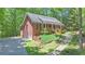 Charming brick home with a covered porch, landscaped front yard, and an attached two-car garage at 150 Gill Ln, Stockbridge, GA 30281
