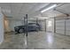 Large garage with vehicle parked inside of it and visible interior and exterior doors at 150 Gill Ln, Stockbridge, GA 30281