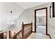 A brightly lit hallway with view into a main bedroom featuring windows and natural lighting at 150 Gill Ln, Stockbridge, GA 30281