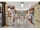 Charming kitchen with brick accents, wood cabinets, a retro refrigerator, and an attached breakfast nook at 150 Gill Ln, Stockbridge, GA 30281