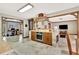 Open kitchen with custom cabinetry and brick accents at 150 Gill Ln, Stockbridge, GA 30281