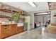 Spacious kitchen with custom wood cabinetry, floating shelves, and a retro refrigerator at 150 Gill Ln, Stockbridge, GA 30281