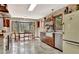 Inviting kitchen with custom cabinets, farmhouse sink, brick accents, and a retro refrigerator at 150 Gill Ln, Stockbridge, GA 30281