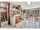 Well-designed kitchen includes custom wood cabinetry, stainless appliances, brick accents, and a walk-in pantry at 150 Gill Ln, Stockbridge, GA 30281