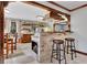 Charming kitchen with brick breakfast bar, wood accents, open shelving, and view to the outside at 150 Gill Ln, Stockbridge, GA 30281