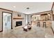 Spacious living room features brick fireplace, wood mantel, and views to the kitchen at 150 Gill Ln, Stockbridge, GA 30281