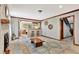 Cozy living room with a brick fireplace, wood accents, and open to the kitchen at 150 Gill Ln, Stockbridge, GA 30281