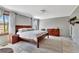 This main bedroom features a wood frame bed, neutral colored walls, and a large area rug at 150 Gill Ln, Stockbridge, GA 30281