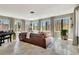 Sunroom with windows, tile flooring, and natural light at 150 Gill Ln, Stockbridge, GA 30281