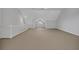 Vast bonus room features vaulted ceilings, white railing, and an abundance of natural light at 1735 Peachtree Ne St # 624, Atlanta, GA 30309