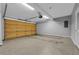 Interior view of garage with epoxy flooring, automated door, and space for vehicles at 1735 Peachtree Ne St # 624, Atlanta, GA 30309