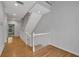 Upstairs hallway with hardwood floors leading to staircase at 1735 Peachtree Ne St # 624, Atlanta, GA 30309
