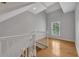 Second floor hallway with hardwood floors and natural light from window at 1735 Peachtree Ne St # 624, Atlanta, GA 30309