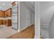 Hallway with hardwood floors and stainless steel refrigerator, blending functionality with style at 1735 Peachtree Ne St # 624, Atlanta, GA 30309