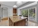 Inviting eat-in kitchen with granite counters, an island, and large windows, filling the space with light at 1735 Peachtree Ne St # 624, Atlanta, GA 30309