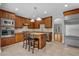 Well-appointed eat-in kitchen features granite counters, stainless appliances, and an island at 1735 Peachtree Ne St # 624, Atlanta, GA 30309