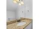 Bathroom featuring granite countertops, a vanity, and updated fixtures at 2858 Spring Villa Se Ln, Smyrna, GA 30080