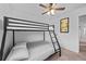 Bedroom featuring a bunk bed, carpet floors and a doorway leading into another room at 2858 Spring Villa Se Ln, Smyrna, GA 30080