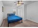 Cozy bedroom with a neutral carpet, a ceiling fan, and a window that fills the space with natural light at 2858 Spring Villa Se Ln, Smyrna, GA 30080