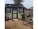 A backyard shed with charming features, flower boxes, and a secure fenced-in area at 64 Citadel Dr, Hampton, GA 30228
