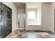 Bright bathroom showcasing a soaking tub, glass-enclosed shower, and neutral tile flooring at 64 Citadel Dr, Hampton, GA 30228