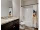 Bathroom featuring a dark wood vanity with granite countertop and a shower with a stylish curtain at 64 Citadel Dr, Hampton, GA 30228