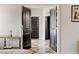 Hallway shows black doors and checkerboard floors in a neutral color scheme at 64 Citadel Dr, Hampton, GA 30228