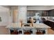 Kitchen boasts a spacious island with seating, modern appliances, and ample counter space at 64 Citadel Dr, Hampton, GA 30228