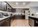 Gourmet kitchen boasts stainless steel appliances and beautiful countertops, perfect for cooking at 64 Citadel Dr, Hampton, GA 30228