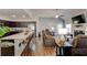 Inviting living room showcasing an open layout, fireplace, and modern kitchen with granite counters at 64 Citadel Dr, Hampton, GA 30228