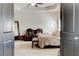 Bright main bedroom features tray ceiling, seating area, and ample natural light at 64 Citadel Dr, Hampton, GA 30228