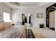Elegant main bedroom boasts tray ceilings, black accent trim, and an ensuite bathroom at 64 Citadel Dr, Hampton, GA 30228