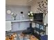 Bright office space with workstation, accent wall tree, and lots of natural light at 64 Citadel Dr, Hampton, GA 30228