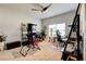 Bright home office with large window providing natural light, ceiling fan, and workspace for two at 64 Citadel Dr, Hampton, GA 30228