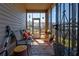 Relaxing screened porch with comfortable seating, ideal for enjoying the outdoors in comfort at 64 Citadel Dr, Hampton, GA 30228