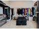 Spacious walk-in closet with ample storage, shelving, and carpeted flooring at 64 Citadel Dr, Hampton, GA 30228