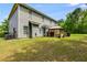 A large backyard with an open lawn and a gazebo, backing up to trees at 7115 Secret Rose, Douglasville, GA 30134