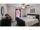 Charming bedroom with a comfortable bed, ceiling fan, and cozy atmosphere at 7115 Secret Rose, Douglasville, GA 30134