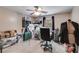 Bright bedroom featuring a ceiling fan, a mannequin, and various storage solutions at 7115 Secret Rose, Douglasville, GA 30134