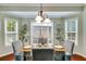 Charming breakfast nook with a glass table and natural light, perfect for enjoying casual meals at 7115 Secret Rose, Douglasville, GA 30134