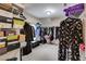 Large walk-in closet with shelving and hanging storage for shoes, clothes, and accessories at 7115 Secret Rose, Douglasville, GA 30134