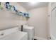 Practical laundry room with shelving, washer, and dryer at 7115 Secret Rose, Douglasville, GA 30134