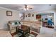 Inviting living area showcasing an open floor plan, comfortable seating, and seamless flow to dining spaces at 7115 Secret Rose, Douglasville, GA 30134