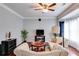 Inviting living room with hardwood floors, a ceiling fan, and lots of natural light at 7115 Secret Rose, Douglasville, GA 30134