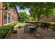 Outdoor area with picnic table, benches, grill and mature trees at 1261 Caroline Se St # 108, Atlanta, GA 30307