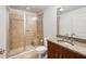 Modern bathroom with granite countertops, glass shower, and tile surround at 1261 Caroline Se St # 108, Atlanta, GA 30307